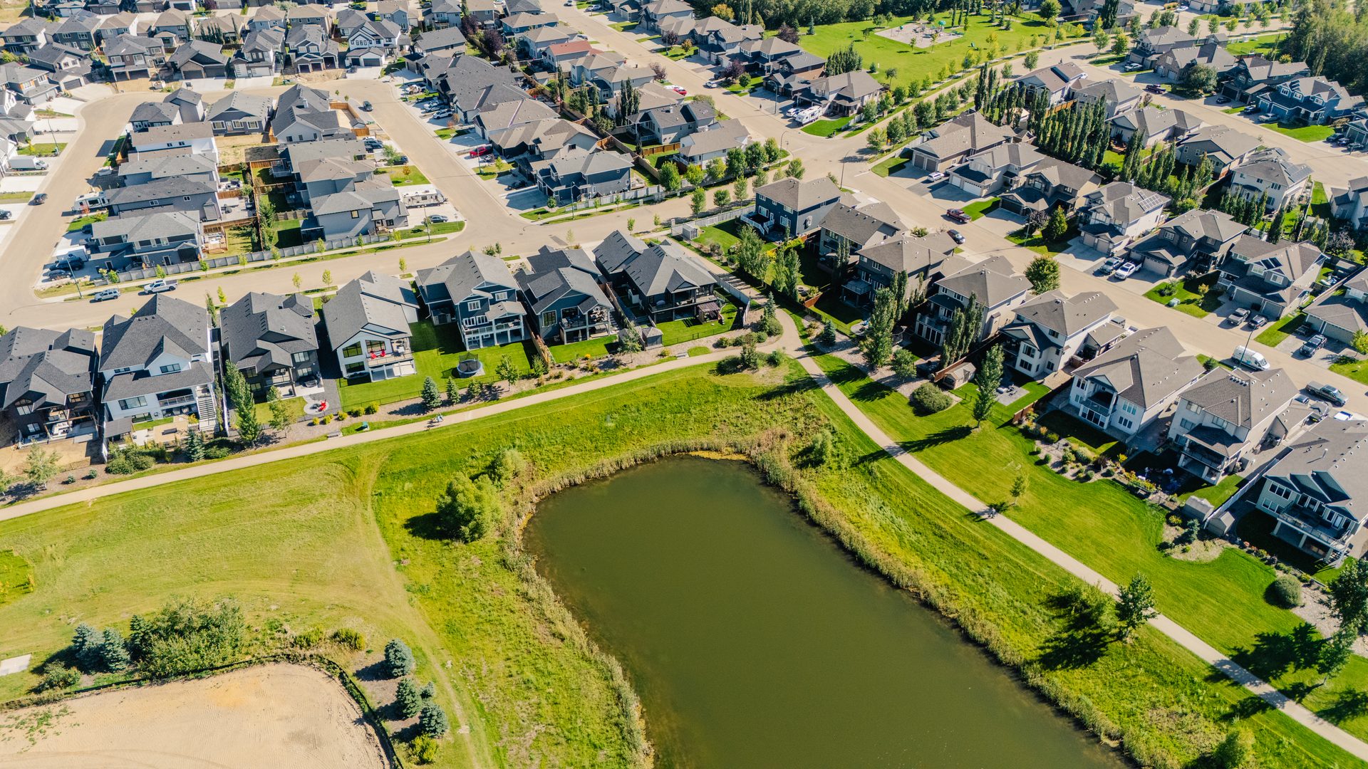 Established homes wrapping the ponds at Deer Park Estates