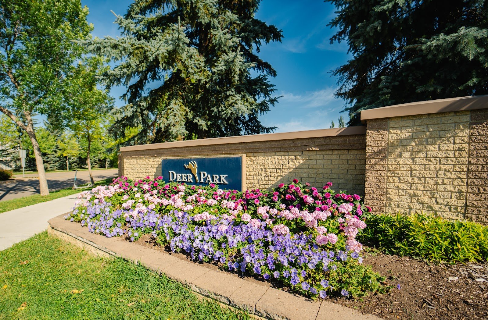 Deer Park entrance sign with flower beds